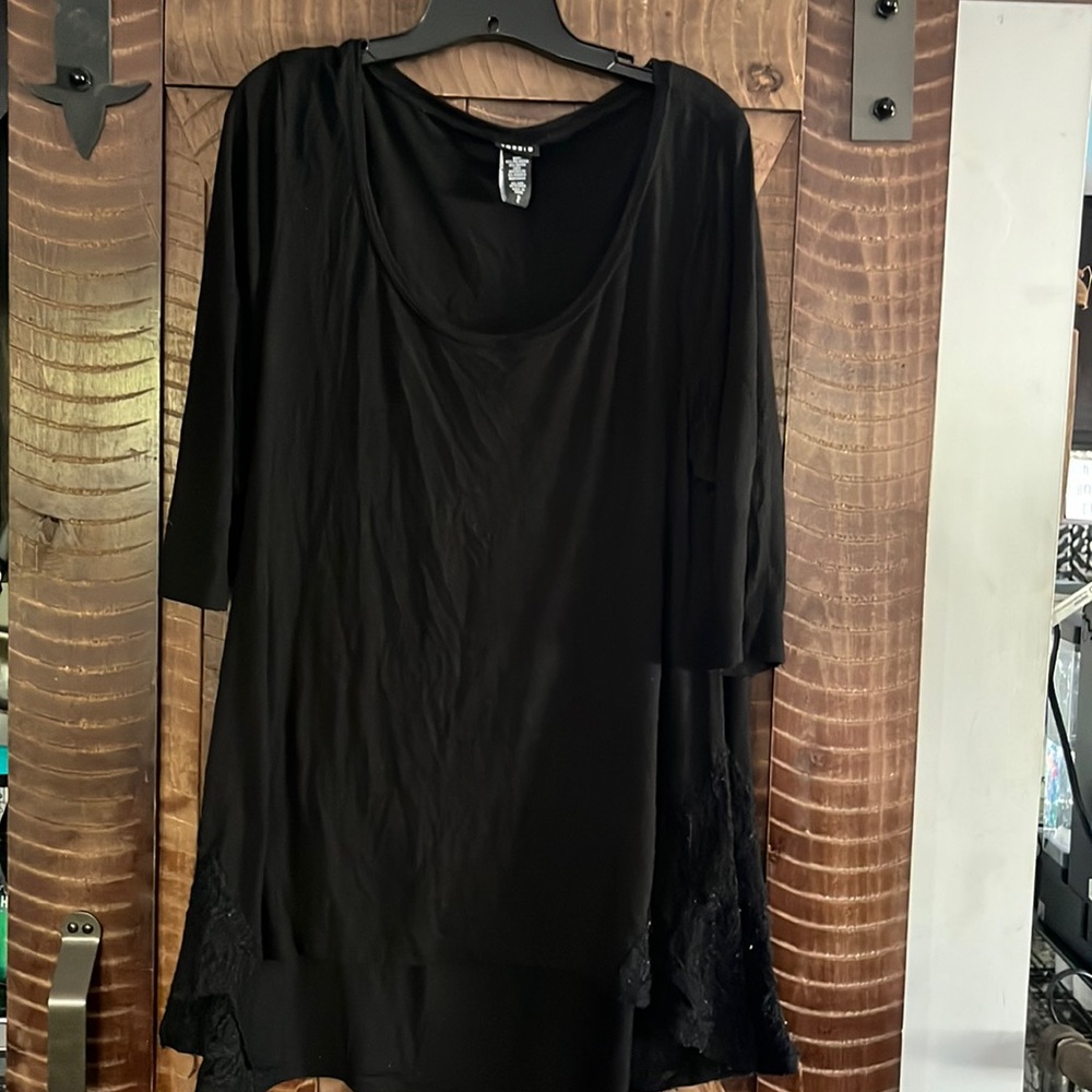 COPY - torrid black tunic length top , lace in bottom hem. Size 2 plus size